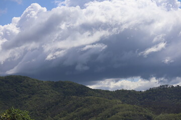 Wall Mural - clouds over the mountains