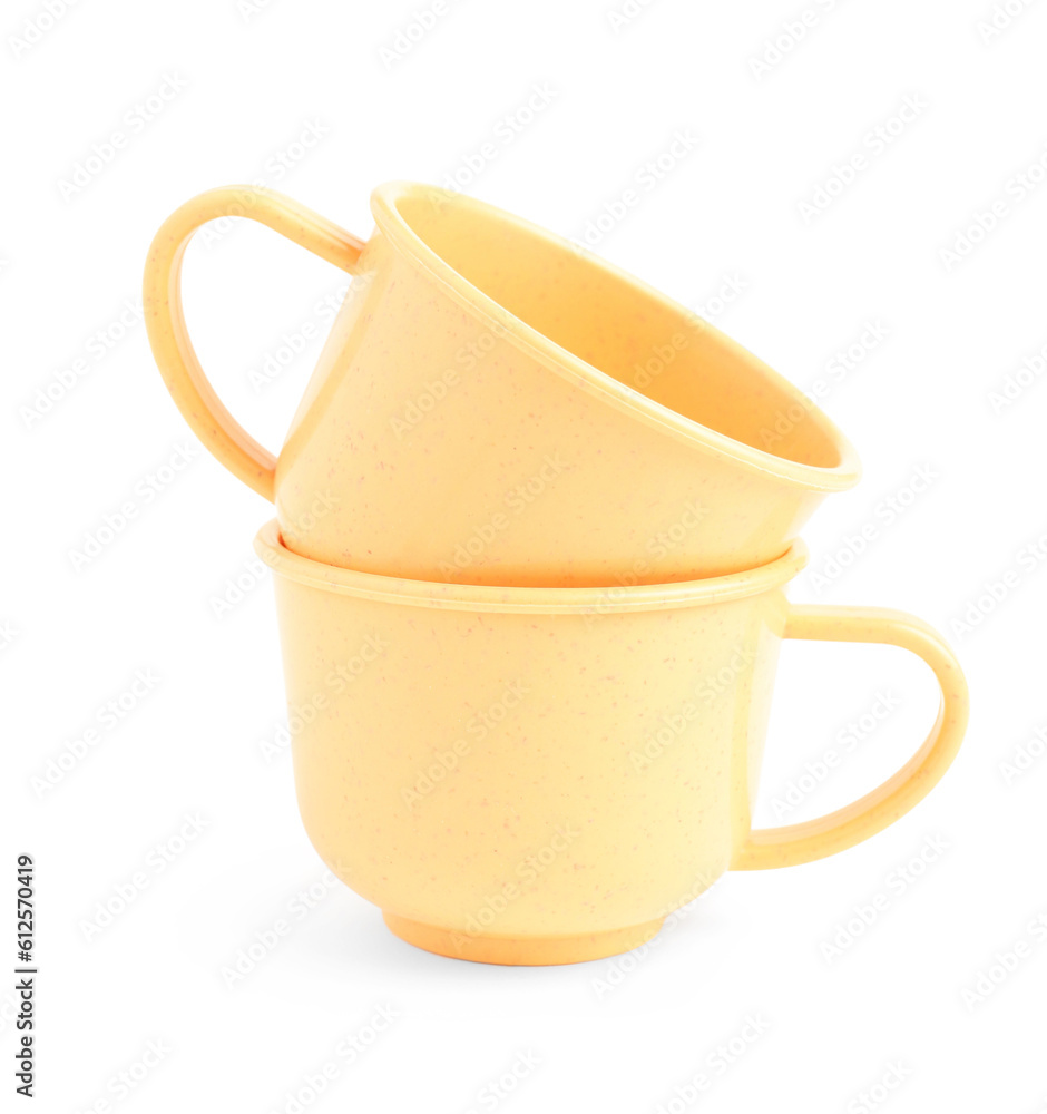 Orange cups isolated on white background. Children's Day celebration