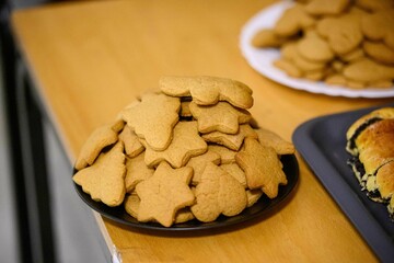 Sticker - Closeup shot of dry biscuits of various shapes on the table