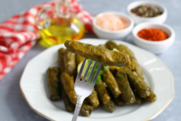 Wall Mural - Stuffed collard greens with boiled leaves, traditonal turkish black sea region food, sarma, dolma. (Selective Focus)