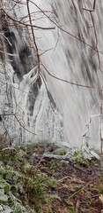 Sticker - Panoramic shot of a waterfall in a forest in Glasgow, Scotland