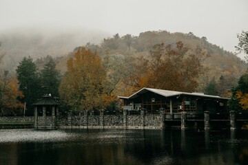 Wall Mural - View of the lake and buildings against the background of a hill. Montreat, North Carolina.