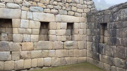 Sticker - Scenic footage of Machu Picchu Citadel ruins with green landscape under clouds and fog