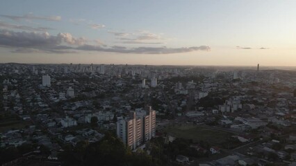 Poster - Aerial view of buildings in a city on the sunset