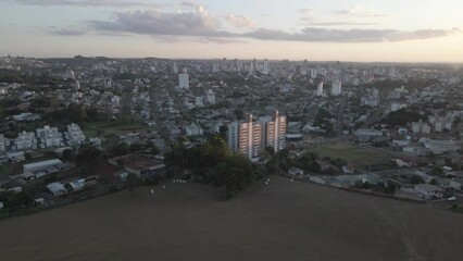 Canvas Print - Aerial view of buildings in a city on the sunset