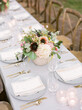© Lexia Frank/Stocksy - dinner table at outdoor wedding reception