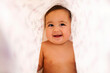 © Valentina Barreto/Stocksy - adorable baby girl laughing