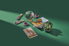 Deck of tarot cards, crystal ball and magic quartz.
