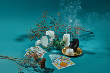 Tarot Cards, Glass Sphere, Candles, Quartz And Dry Plants.