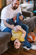 © Serena Burroughs/Stocksy - father and daughter playing together indoors