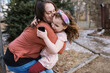 © Serena Burroughs/Stocksy - Mother and daughter hugging
