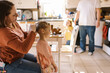 © Serena Burroughs/Stocksy - Mom styling hair of her toddler daughter in kitchen at home