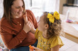 © Serena Burroughs/Stocksy - mother and daughter together indoors