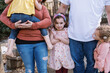 © Serena Burroughs/Stocksy - Happy family standing in front of home in spring outdoors