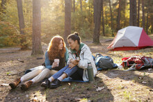 Friend drink campground nature holiday chill conversation