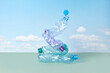 © Yaroslav Danylchenko/Stocksy - Crumpled plastic bottles on blue sky background.
