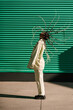 © Ezequiel Giménez/Stocksy - Calm woman with flying hair on city street