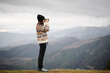© Nuria Seguí/Stocksy - Traveler Woman Taking Photos