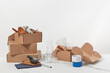 © Yaroslav Danylchenko/Stocksy - Open cardboard boxes with dishware and glassware.