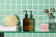 © Marc Tran/Stocksy - Towel, soap bar bath sponge, and bottle of cosmetic product