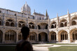 © Alvaro Lavin/Stocksy - woman in the monastery of los jeronimos