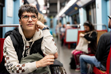 Woman Sitting In Subway Car