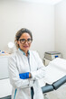 © Alvaro Lavin/Stocksy - portrait of a doctor in her office