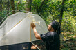 Man setting a malaise trap in nature