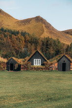 Black Wooden Cabin With Grass Roof In Icelandic Countryside.