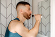 © Lucas Ottone/Stocksy - Modern man brushing his teeth
