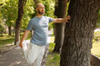 © Danil Nevsky/Stocksy - Male training near tree in park