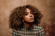 © VICTOR TORRES/Stocksy - Beautiful latin woman with curly hair