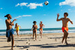 © BONNINSTUDIO/Stocksy - Happy friends playing with ball on beach