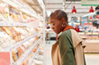 © Ivan Gener/Stocksy - Woman shopping in a supermarket