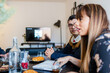 © ByLorena/Stocksy - Business people meeting while having brunch