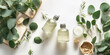 © Ployker - Spa concept with eucalyptus oil and eucalyptus leaf extract natural /organic spa cosmetics products, eco friendly bathroom accessories. Skincare concept on white background. Flat lay composition