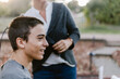© ByLorena/Stocksy - Happy teenager boy shaving hair outside home