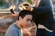 © ByLorena/Stocksy - Profile Teenager shaving hair outdoors