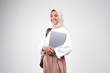 © faishalabdula - Young muslimah female student is carrying laptop. Prepare back to school isolated white background