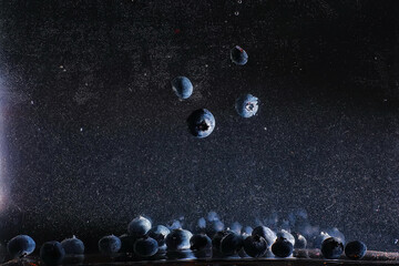 Water drops on ripe sweet blueberry. Fresh blueberries background with copy space for your text. Vegan and vegetarian concept.