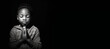 © JoelMasson - Black and white studio portrait of a young child praying banner on black background. Generative AI illustration