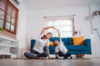 © Kiattisak - Mother and daughter exercising together happily at home. for flexibility build muscle strength, Sport workout training family together concept.