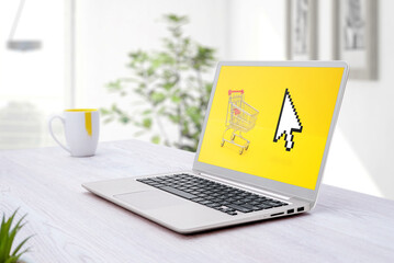 Wall Mural - laptop with shopping card and mouse cursor on laptop screen. online ecommerce shoping concept