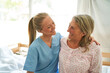 © Robert Kneschke - Happy caregiver with elderly woman at rehab center