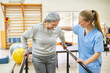 © Robert Kneschke - Physiotherapist assisting elderly patient in exercise at rehab center