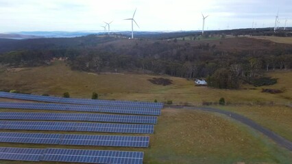 Wall Mural - aerial drone pullback reverse view of the hybrid gullen solar farm and gullen range wind farm for re