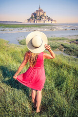 Wall Mural - Woman travel in Normandie- Mont Saint Michel in France