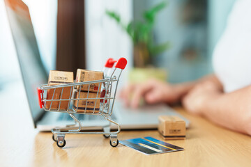 woman hand holding credit card and using laptop with mobile phone for online shopping while making order. Marketplace platform website, technology, ecommerce, shipping delivery and online payment