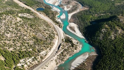 Wall Mural - a drone view of the river in the woods. an aerial view of an autumn forest. winding river among the 