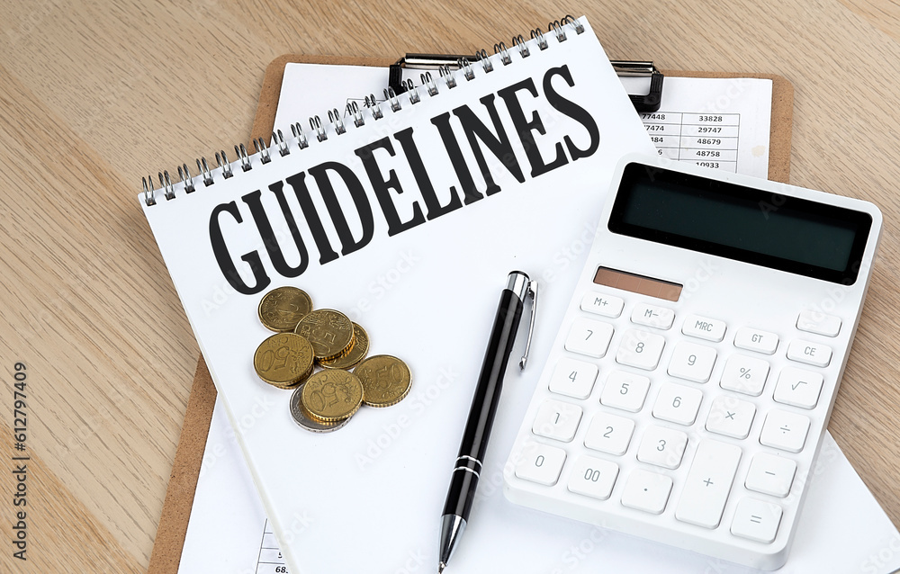 Guide Article Photo Stock GUIDELINES text on a notebook with chart and calculator and ...